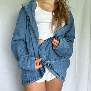 zip-up jean jacket with plaid hood interior.